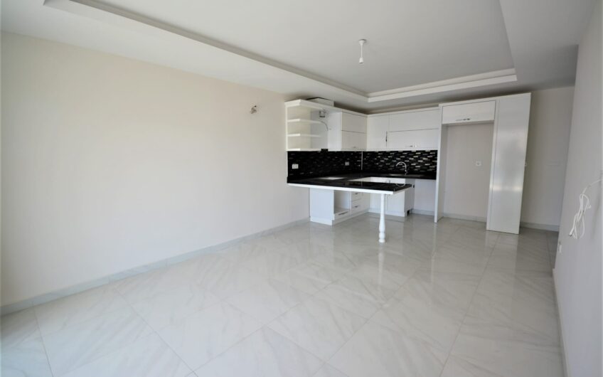 2 room apartment suitable for citizenship for sale in a central location in Mahmutlar
