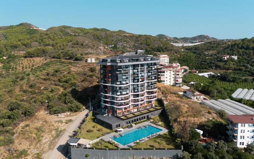 2+1-lägenhet i två plan med egen trädgård och havsutsikt till salu i Demirtaş, Alanya